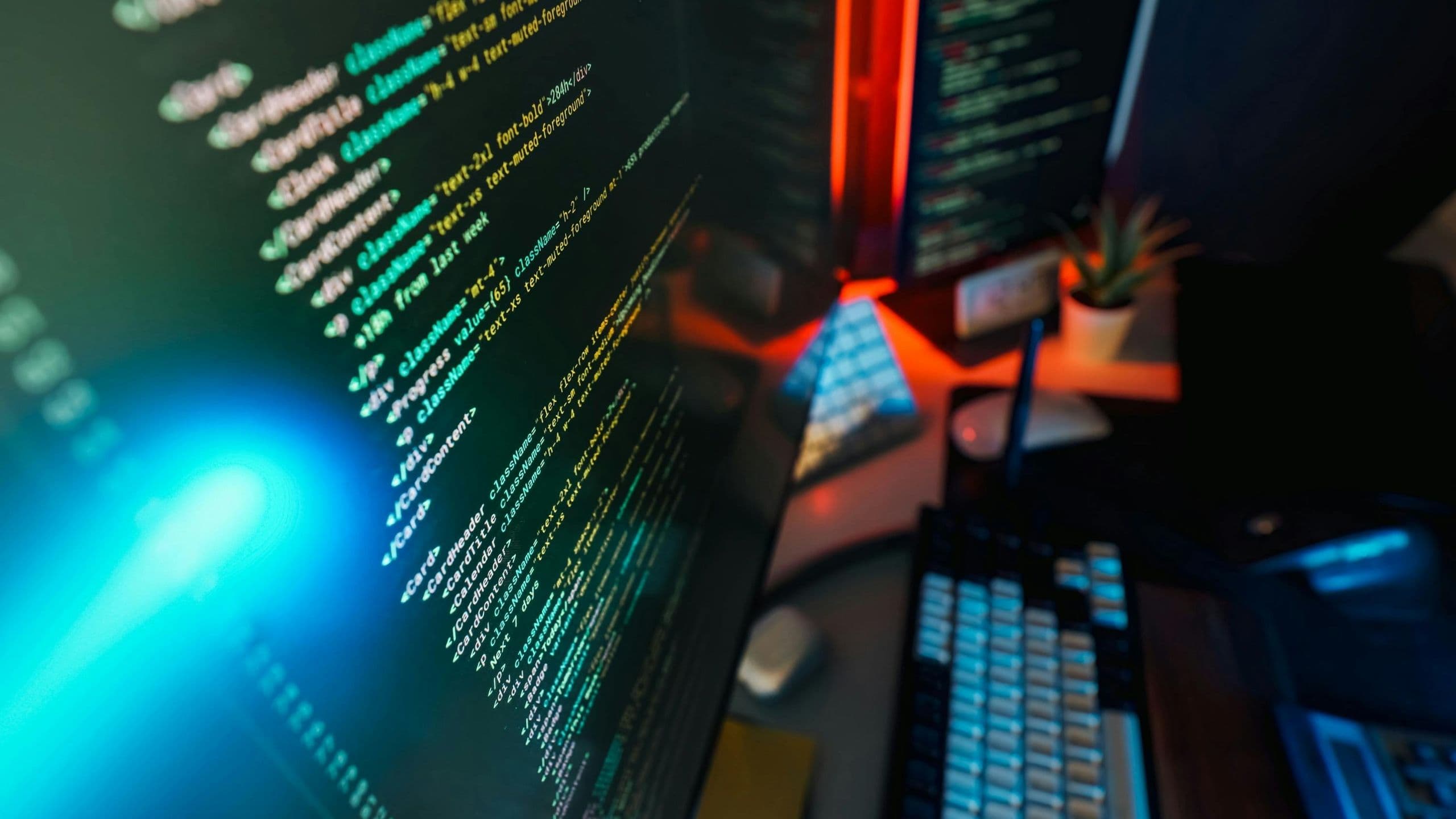 Engineer testing simulation on multiple monitors